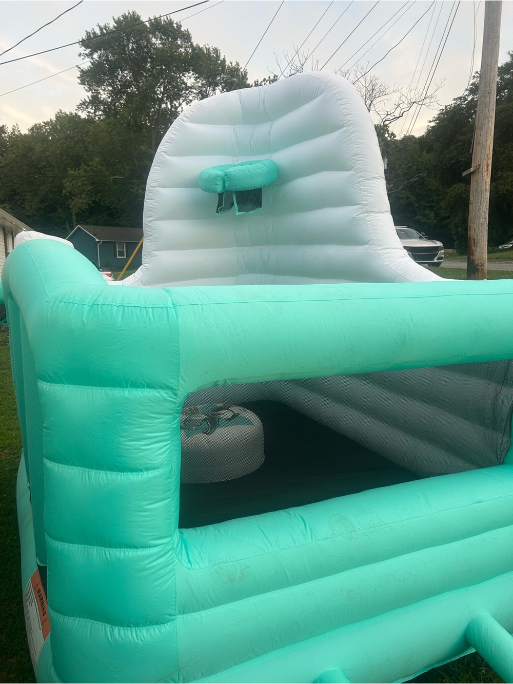 Dude Perfect Mint Green and white Inflatable Bounce house with 2 basketballgoals